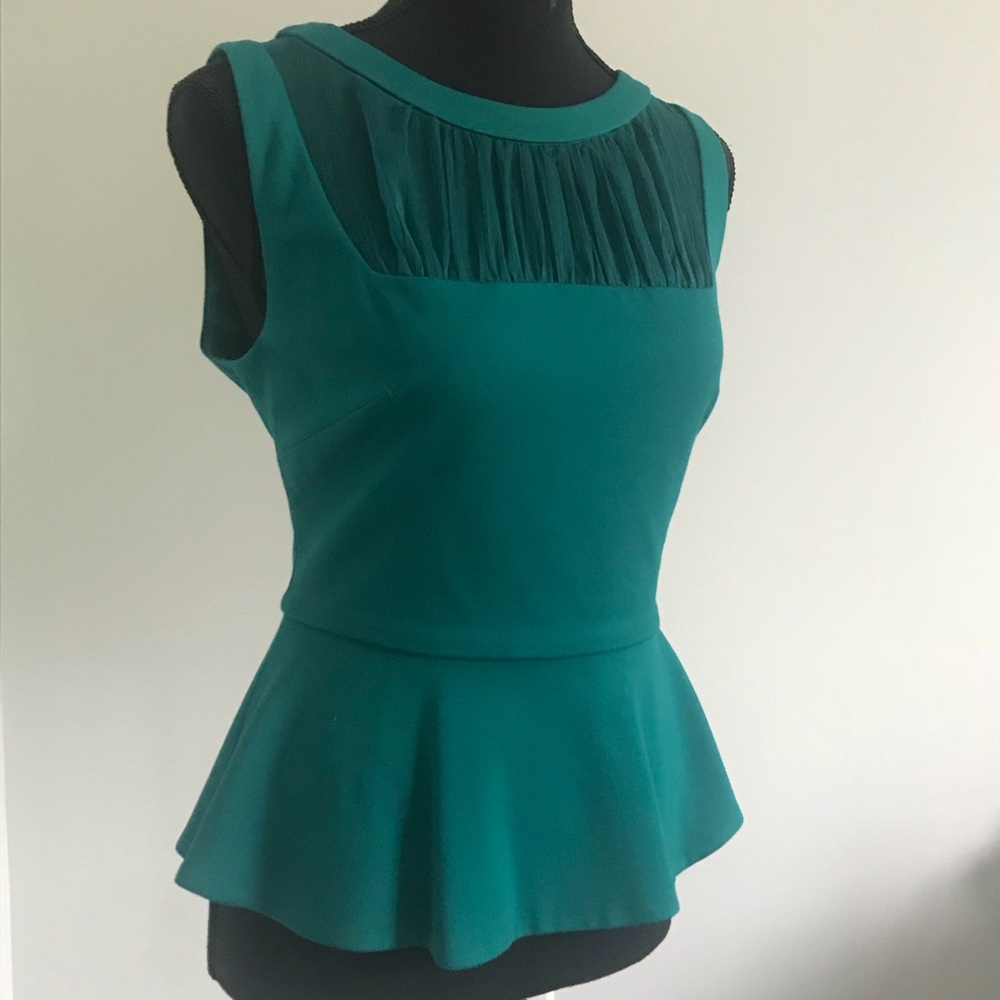 BEBE sheer peplum top